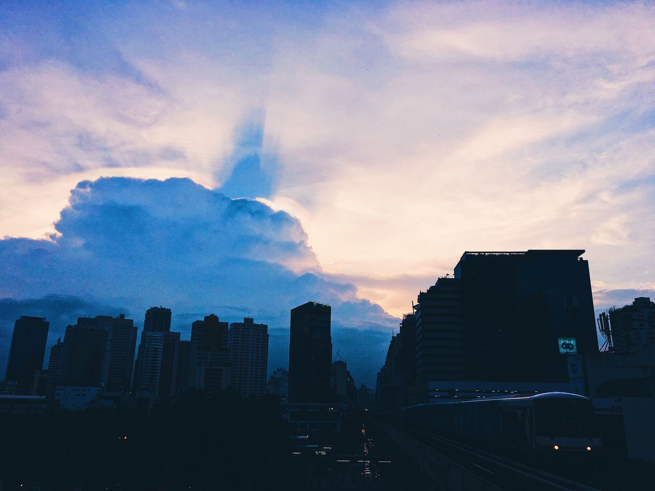 architecture, city, skyscraper, building exterior, built structure, sky, cityscape, cloud - sky, city life, no people, silhouette, outdoors, sunset, urban skyline, travel destinations, modern, day