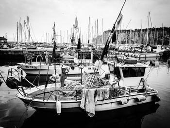 Boats moored at harbor