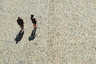 High angle view of couple walking on street