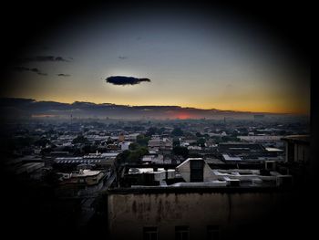 High angle view of townscape against sky at sunset