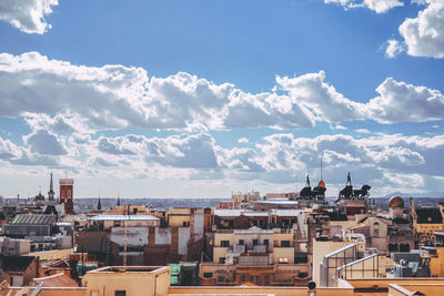 View of town against cloudy sky