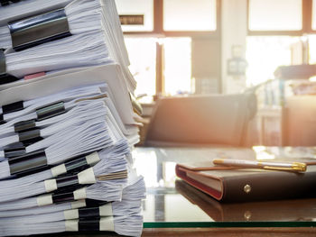 Stack of papers on table at office