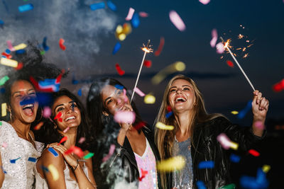 Group of people enjoying at night