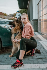 Full length of woman with dog