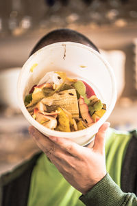 Close-up of woman eating ice cream in bowl