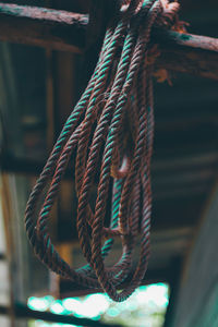 Close-up of rope tied up on metal