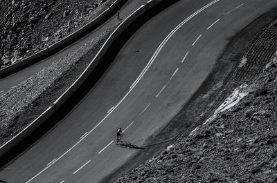 High angle view of person riding bicycle on road