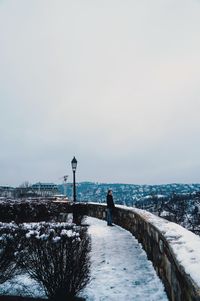 Scenic view of snow covered bridge against sky