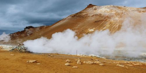 Smoke emitting from volcanic mountain