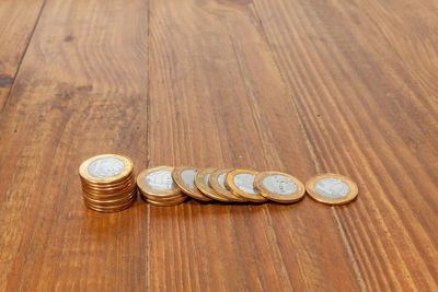 High angle view of coins on table