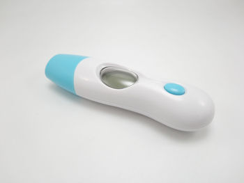 Close-up of eyeglasses on table against white background