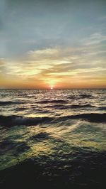 Scenic view of sea at sunset