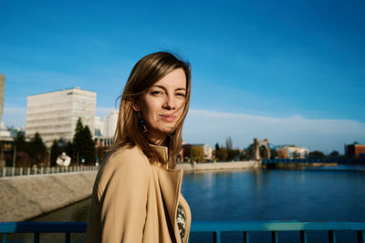 Cheerful woman walks at europe city street