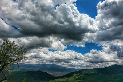 Scenic view of landscape against cloudy sky