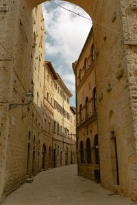 Street amidst buildings against sky