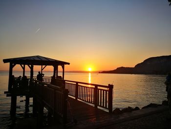 Scenic view of sea against clear sky during sunset