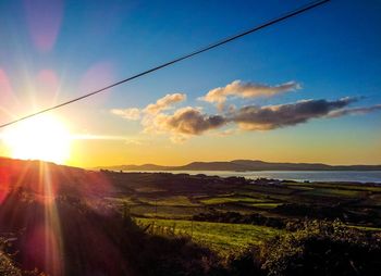 Sun shining over landscape