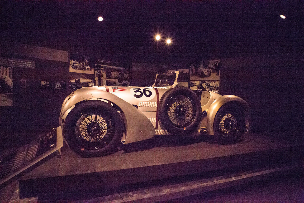 HIGH ANGLE VIEW OF ILLUMINATED CAR ON STREET