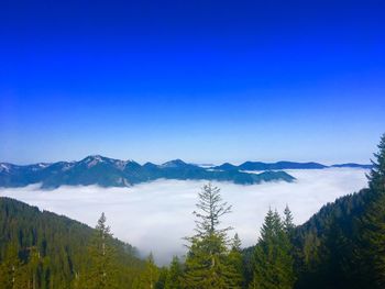 Scenic view of mountains against clear blue sky