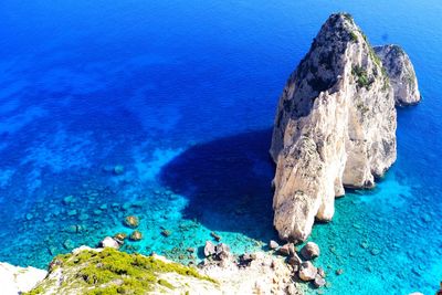 High angle view of rock formation in sea