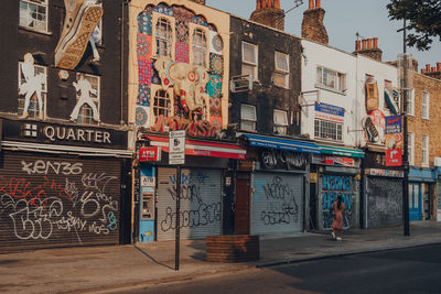 Graffiti on wall by building in city