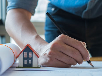 Close-up of man working on table