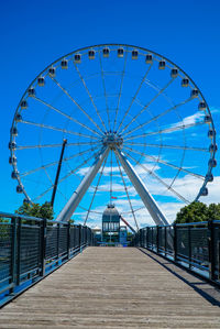 Ferris wheel against blue sky