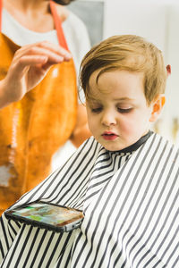 Close-up of boy looking at camera