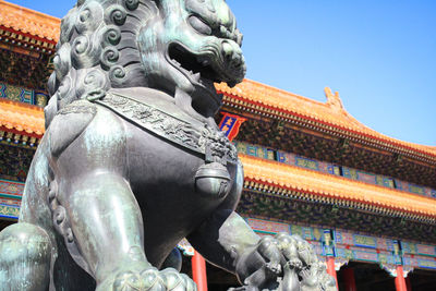 Low angle view of statue in city