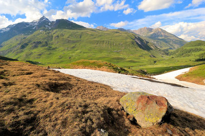 Scenic view of landscape and mountains against sky