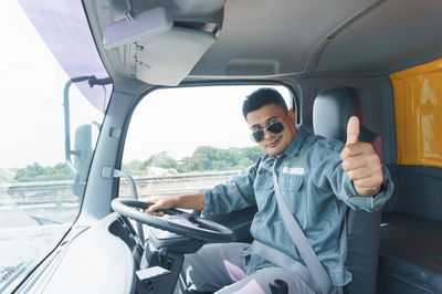 Portrait of man sitting in truck