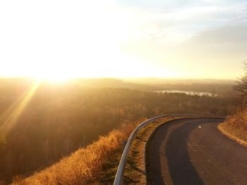 Scenic view of road against sky during sunset