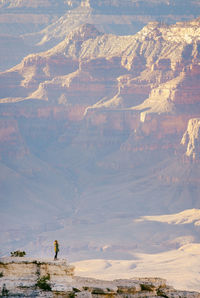 Man standing on mountain against sky