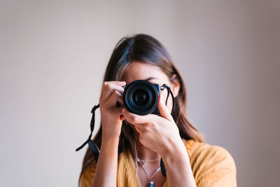 Portrait of woman photographing