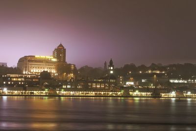 Illuminated buildings in city at night