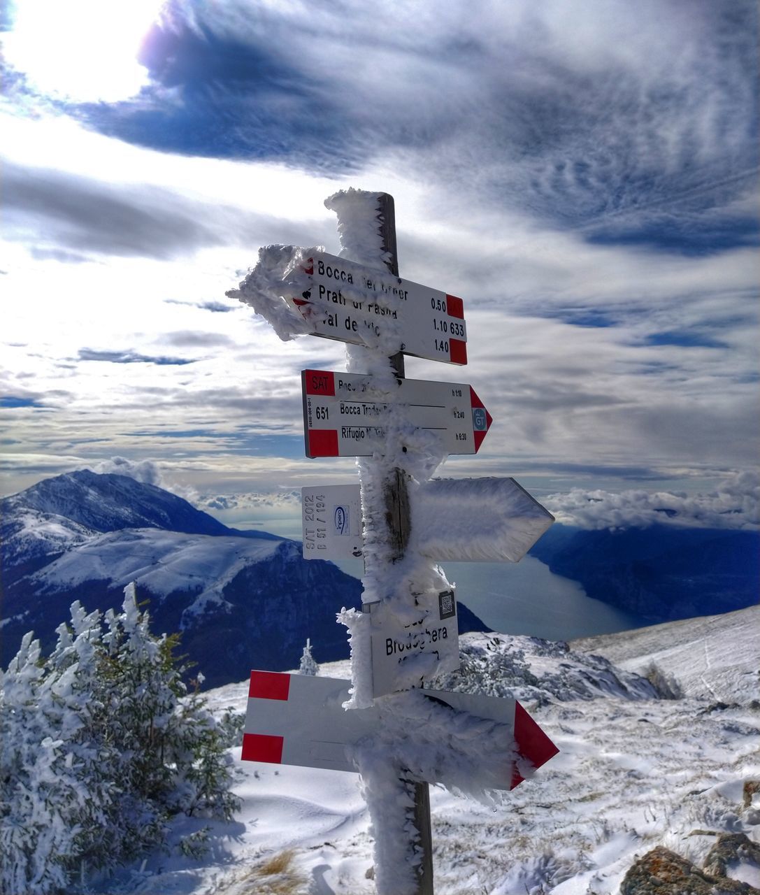 BUILT STRUCTURE ON SNOWCAPPED MOUNTAINS AGAINST SKY