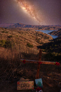 Scenic view of field against sky at night