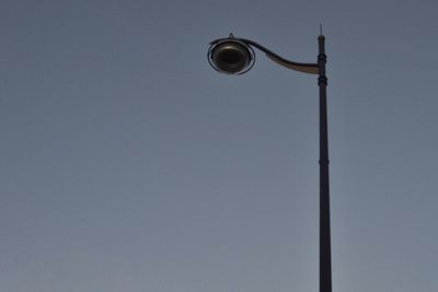 Low angle view of street light against sky