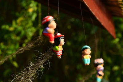 Close-up of stuffed toy hanging on rope