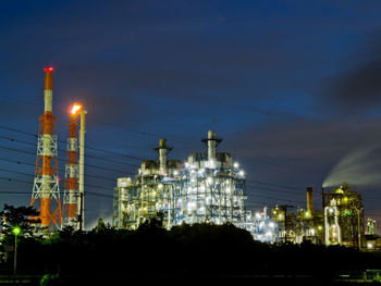 Night view of oil refinery at dusk.