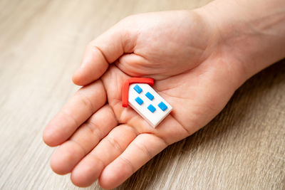 Close-up of hand holding toy blocks