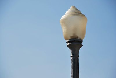 Low angle view of street light against clear sky