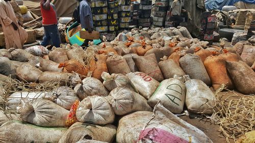 Workers working with plastic bags at commercial dock