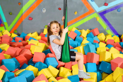 Portrait of smiling girl with toy toys