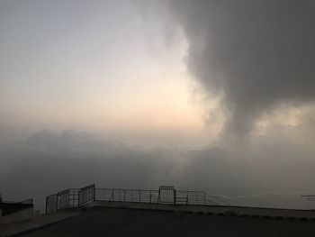 Low angle view of bridge against sky during sunset