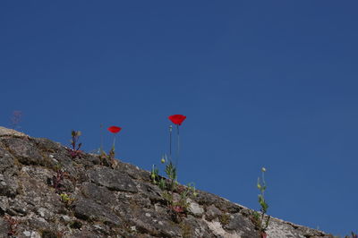 Low angle view of mountain against clear blue sky