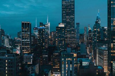 Illuminated buildings in city at night