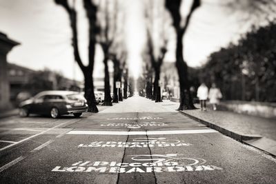 Close-up of text on road in city