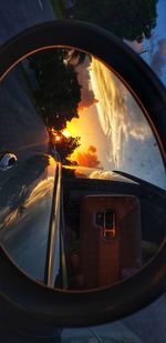 Reflection of sky on side-view mirror