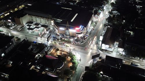 High angle view of illuminated city street at night